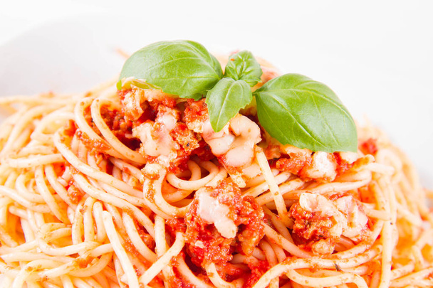 Spaghetti bolognese with melted parmesan cheese  on a white background - Foto, immagini