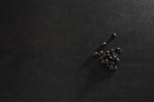 Coffee grains and fragrant cinnamon sticks on brutal, rusty metal - Photo, image