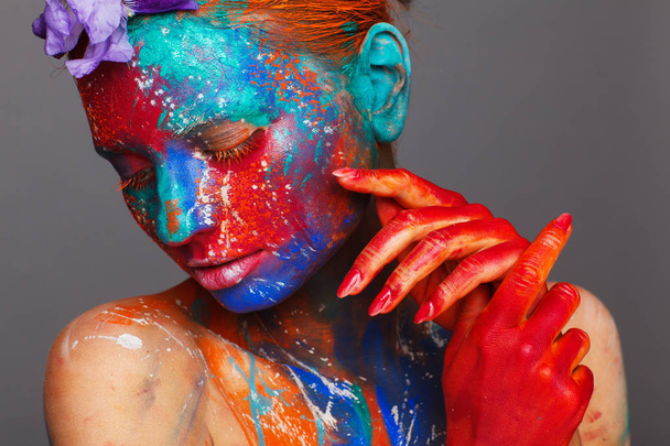 Creative fantastic makeup using colorful paints on the model - Fotografie, Obrázek