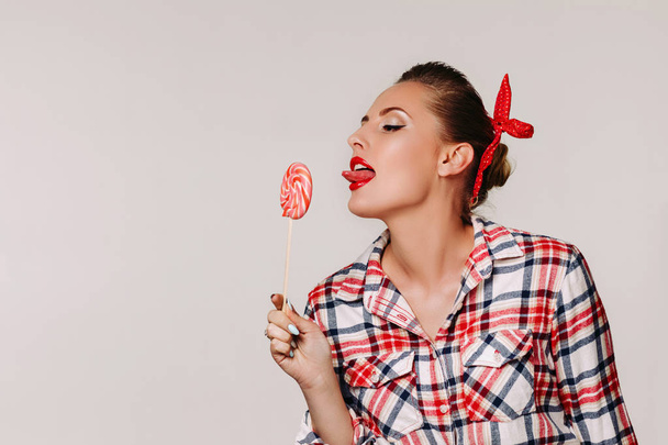 beautiful pin-up woman with lollipop. - Fotografie, Obrázek