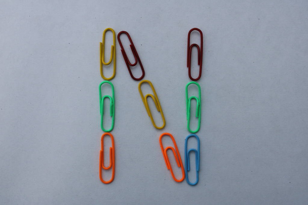 Letter N made with colorful paper clips on white background closeup shot, can be used as graphic resource - Photo, Image