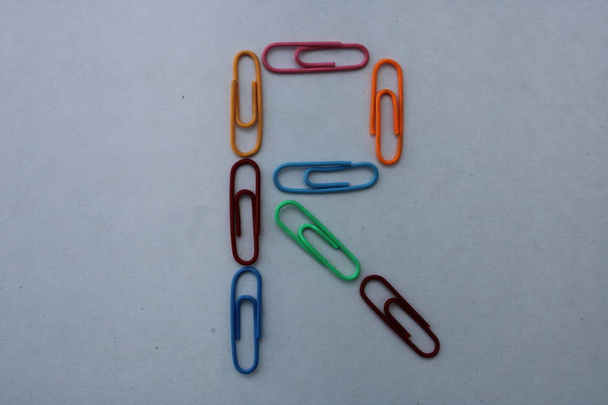 Letter R made with colorful paper clips on white background closeup shot, can be used as graphic resource - Photo, Image