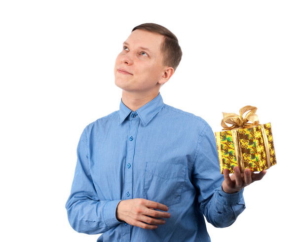 A young man offering a gift to you - Фото, изображение