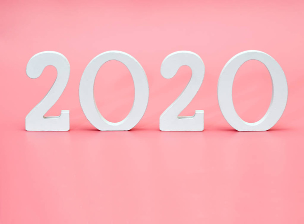 Figures new year 2020 on a pink background and copy space. - Fotó, kép