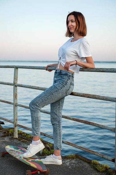Young hipster girl with longboard - Zdjęcie, obraz