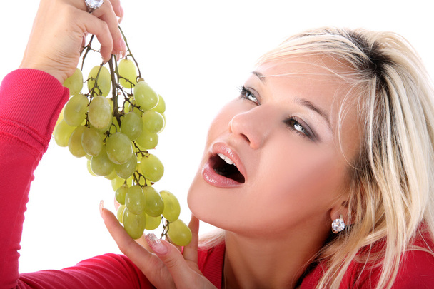 Girl with fresh grape isolated on white - Фото, изображение