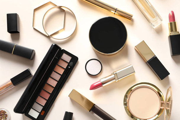 Different luxury makeup products on color background, flat lay - 写真・画像