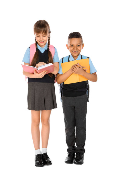 Full length portrait of cute children in school uniform on white background - Фото, изображение