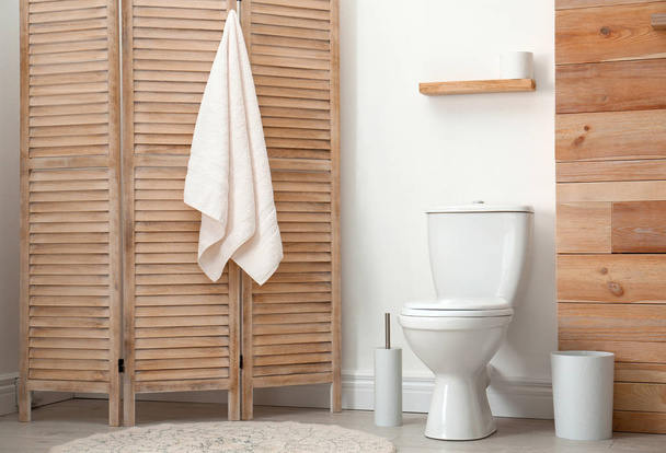 Toilet bowl near white wall in modern bathroom interior - Foto, Imagem