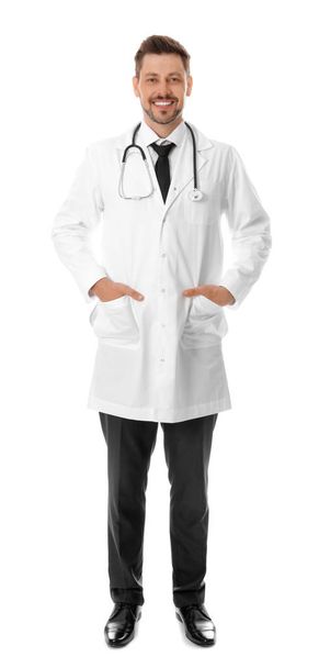Full length portrait of smiling male doctor isolated on white. Medical staff - Photo, Image