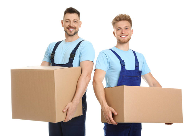 Portrait of moving service employees with cardboard boxes on white background - Foto, Imagen