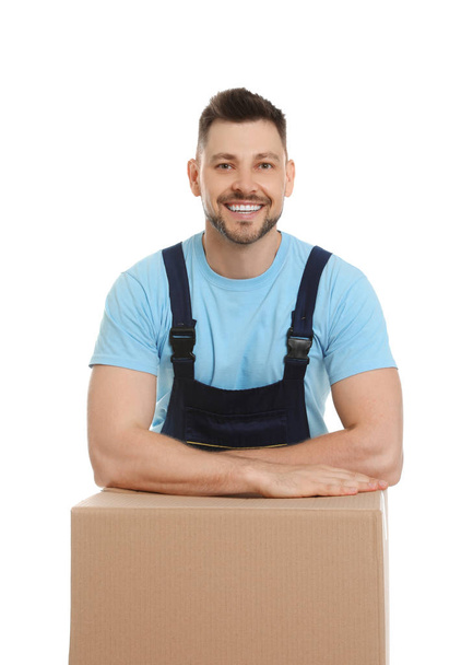 Portrait of moving service employee with cardboard box on white background - Photo, Image