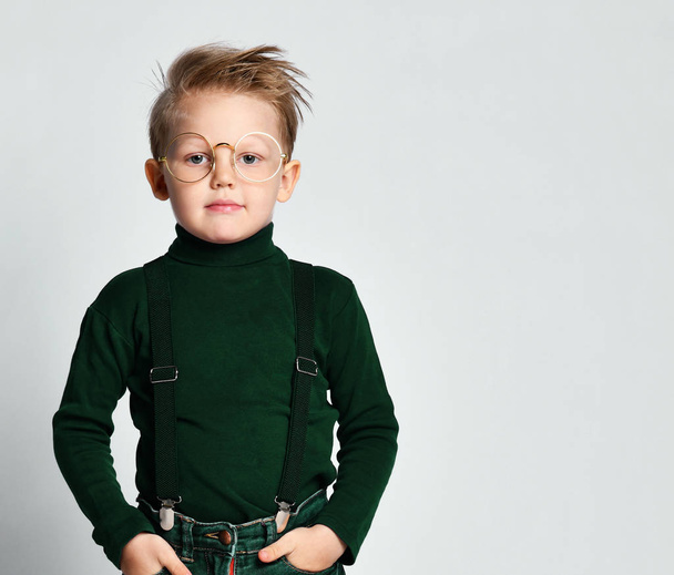 Portrait of a stylish little boy with glasses. Kid isolated on a light background. Success, idea, knowledge and study - Foto, imagen