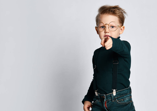 Portrait of a stylish little boy with glasses. Kid isolated on a light background. Success, idea, knowledge and study - Valokuva, kuva