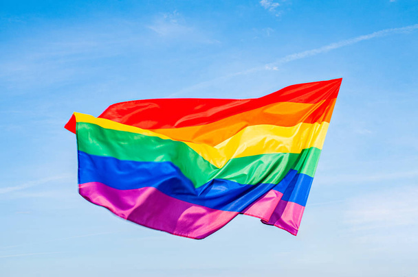 LGBT flag on blue sky. Gay Rainbow flag.  - Fotó, kép