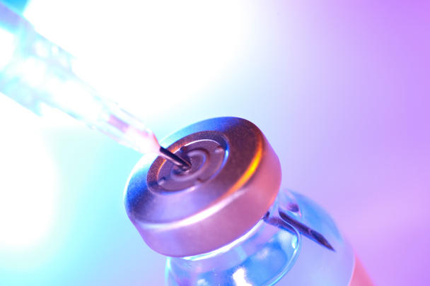 Drug vial with syringe background - Фото, изображение