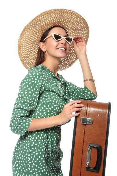Female tourist with luggage on white background - Foto, afbeelding