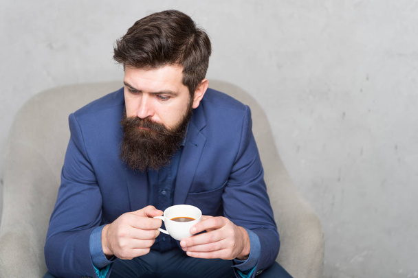 The coffee you can rely on. Businessman drinking coffee in the morning. Bearded man enjoying his coffee break. Hipster holding coffee cup, copy space - 写真・画像