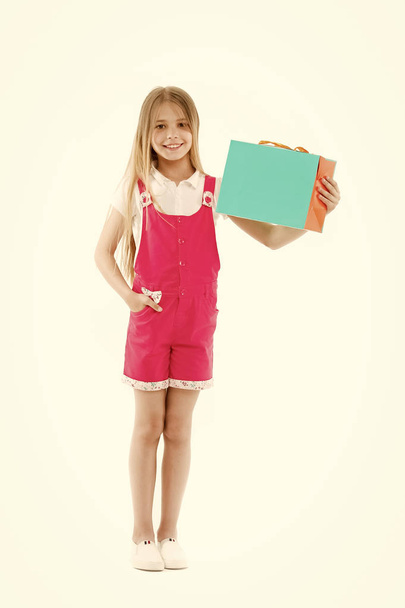 Happy girl hold paperbag isolated on white. Little shopaholic smile with shopping bag. Child shopper smiling with paper bag. Black Friday and sale. I made my choice, copy space - Photo, Image