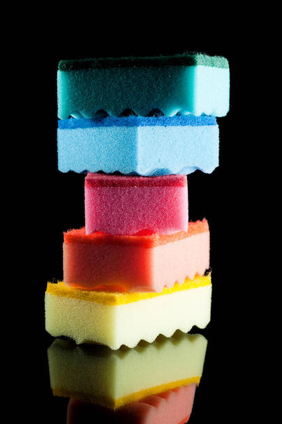Tower of kitchen sponges for washing dishes. Green, blue, pink,  - 写真・画像