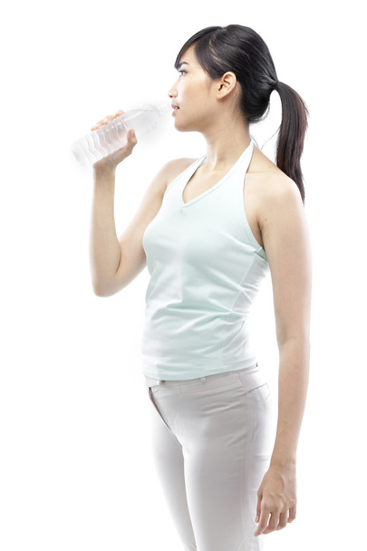 Pretty girl drinking water from bottle - Foto, immagini