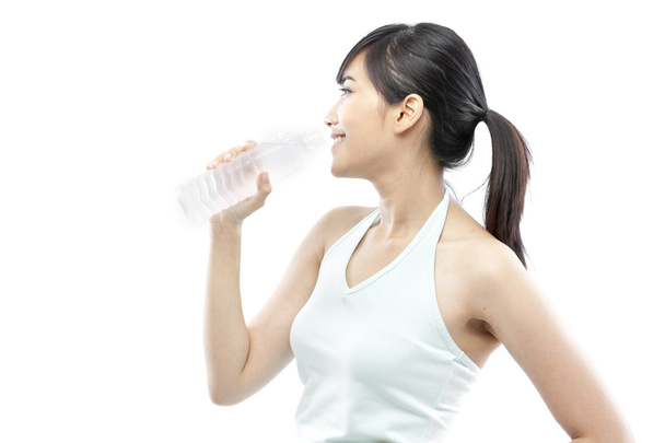 Pretty girl drinking water from bottle - Zdjęcie, obraz