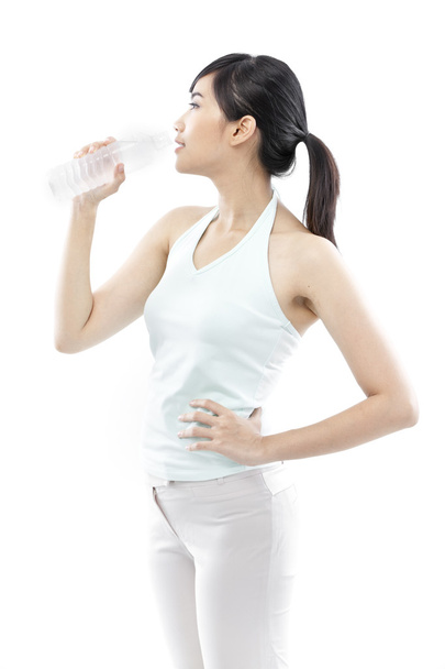 Pretty girl drinking water from bottle - Фото, зображення