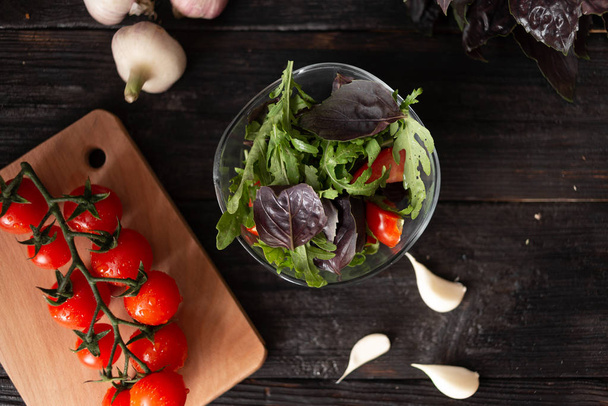 fresh summer salad with cherry tomatoes basil arugula garlic oli - Photo, Image