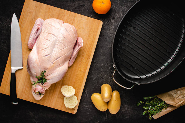 Whole Duck Fresh and Raw on Chopping Board with Ingredients Ready to Cook - Fotoğraf, Görsel