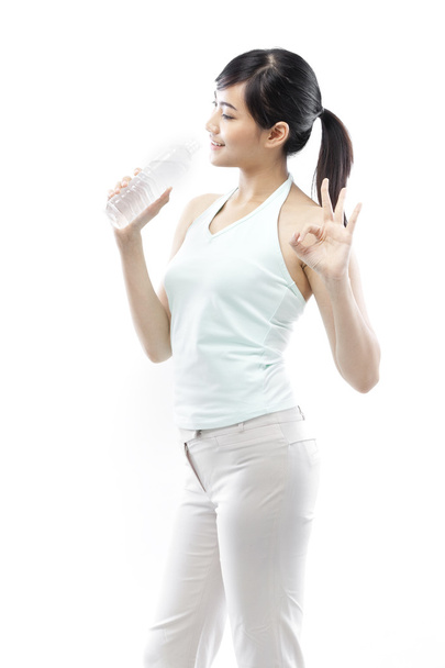 Pretty girl drinking water from bottle - Фото, зображення