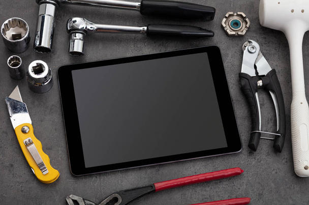 Household tools and tablet with empty screen  - Valokuva, kuva