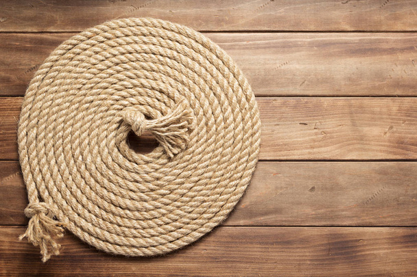 ship rope at wooden background texture - Foto, imagen