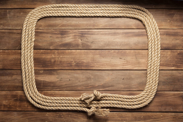 corda do navio no fundo da placa de madeira
 - Foto, Imagem