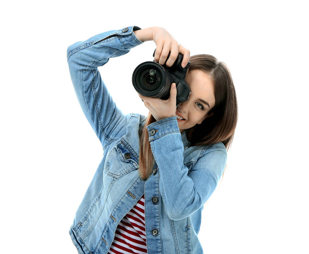 Young female photographer on white background - Photo, Image