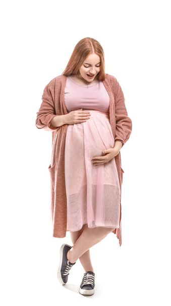 Bella donna incinta su sfondo bianco - Foto, immagini