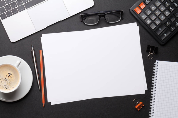 Office workplace table with blank paper page - 写真・画像