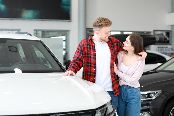 Couple choosing new car in salon - Photo, Image