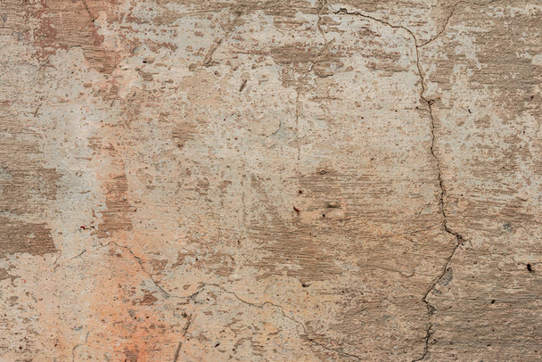 textura de una pared de hormigón con grietas y arañazos que se pueden utilizar como fondo - Foto, imagen
