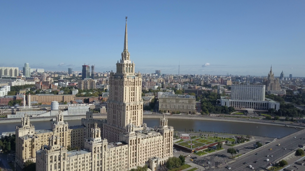 Aerial view of hotel Ukraine in Moscow. Old Soviet Russia Stalin high-rise skyscrapers in heart of modern Moscow City. Kutuzov avenue day traffic. - Footage, Video
