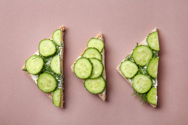 Tasty sandwiches with cucumber on color background - Φωτογραφία, εικόνα