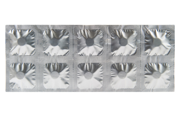 Closed up medicine tablet in aluminum foil strip background - Photo, Image