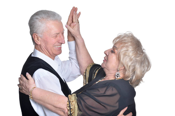 Portrait of happy  senior couple   dancing on  white background - Foto, Imagem