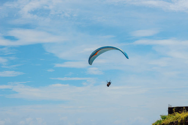 Paraglider flying sport, wing in blue sky - Photo, image