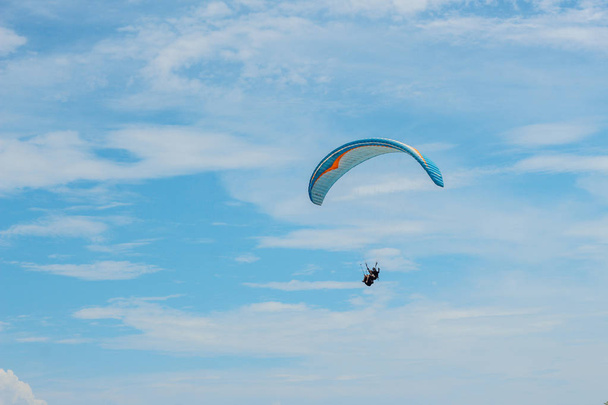 Paraglider flying sport, wing in blue sky - Fotó, kép
