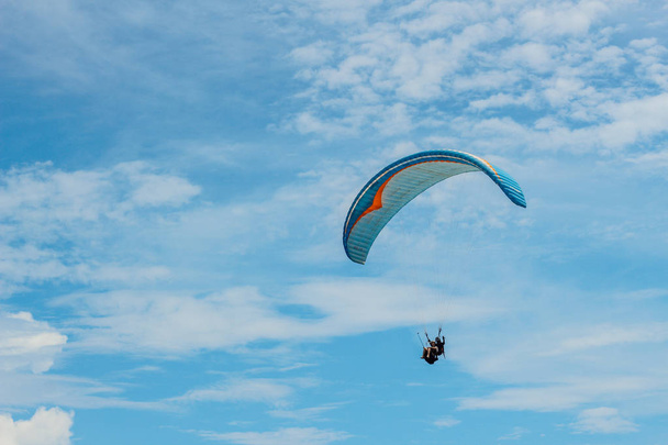 Paraglider flying sport, wing in blue sky - Fotó, kép
