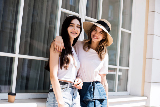 Friends for a walk, attractive young women, summer mood, positive, active day off, happy day, smiles and happiness on faces, walk with friends, positive, fun, enjoyment, happiness, friendship - 写真・画像