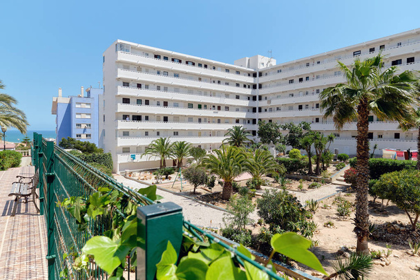 Modern high rise multi-storey residential house exterior with inner yard garden in resort spanish city of Torrevieja, Costa Blanca, Province of Alicante, Spain - Foto, imagen