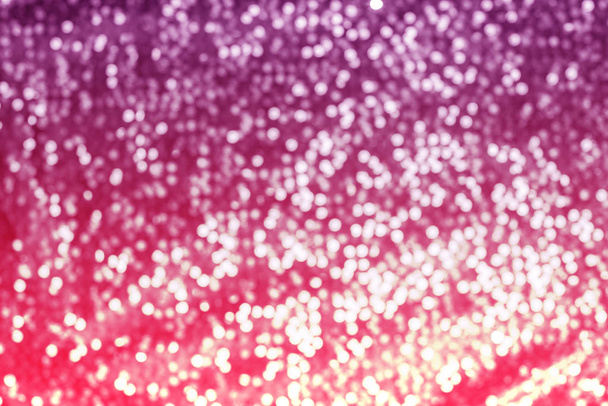 光沢のあるピンクのデフォーカスのきらめくお祝いの背景テクスチャ - 写真・画像