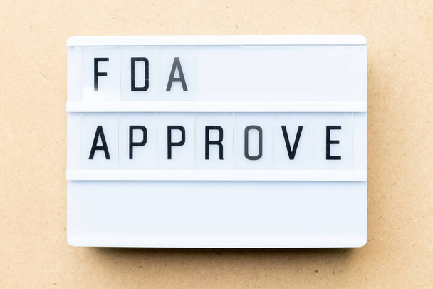 Fehér lightbox szó FDA által jóváhagyott fából készült háttér - Fotó, kép