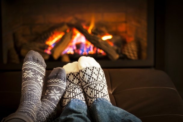 Feet warming by fireplace - Photo, Image